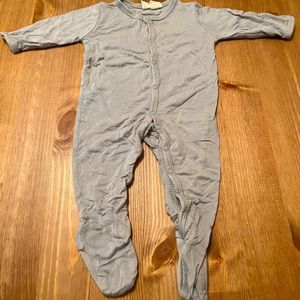 Light grey button down KYTE baby footie. Good condition. Some pilling. No stains